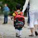 A youngster walks with an adult outside of Logan Elementary School on the first day of school on Tuesday, September 3, 2013. Melanie Maxwell | AnnArbor.com